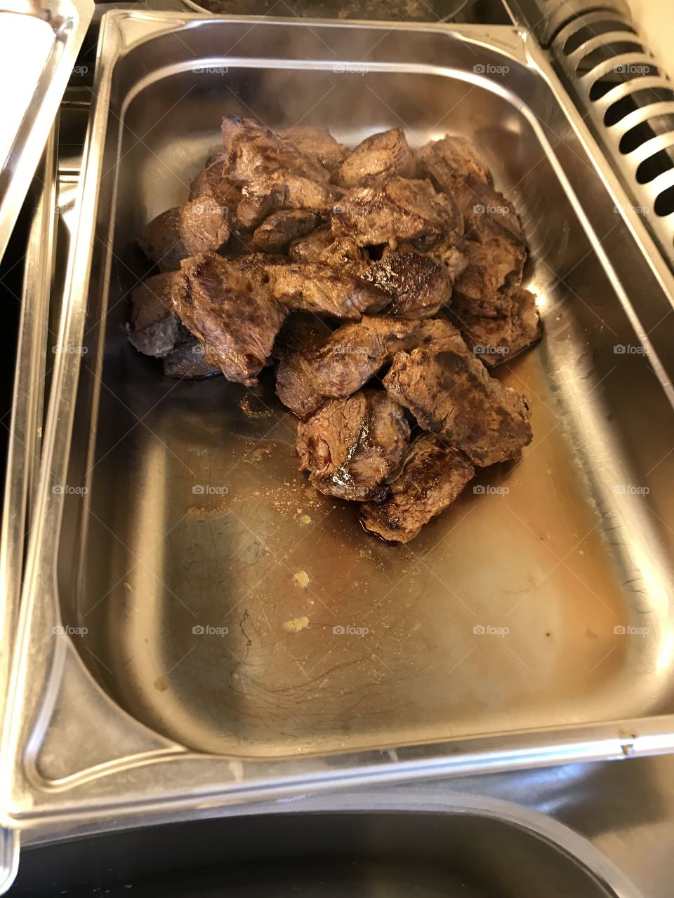 Preparations for dinner at a restaurant. Some good pieces of steaks. Tasted really good.