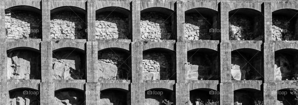 A stonewall supported by brick arches in Porto, Portugal