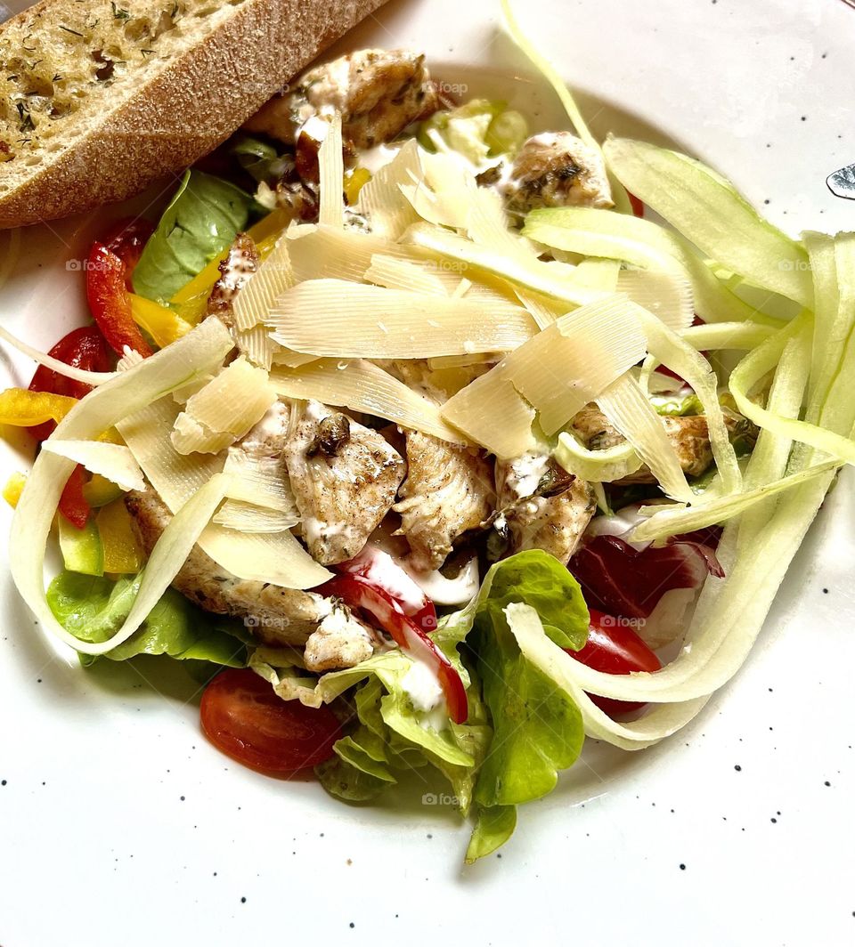 Salad with chicken, cheese and vegetables