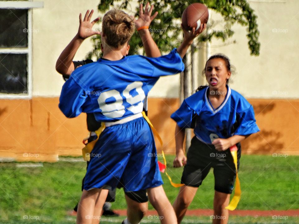 Boys And Girls Playing Team Sports
