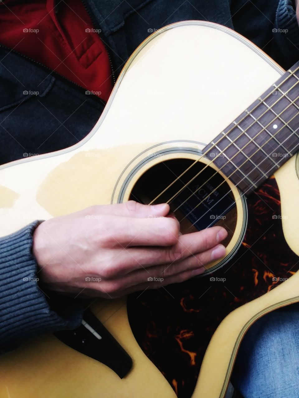 Acoustic guitar player -close-up