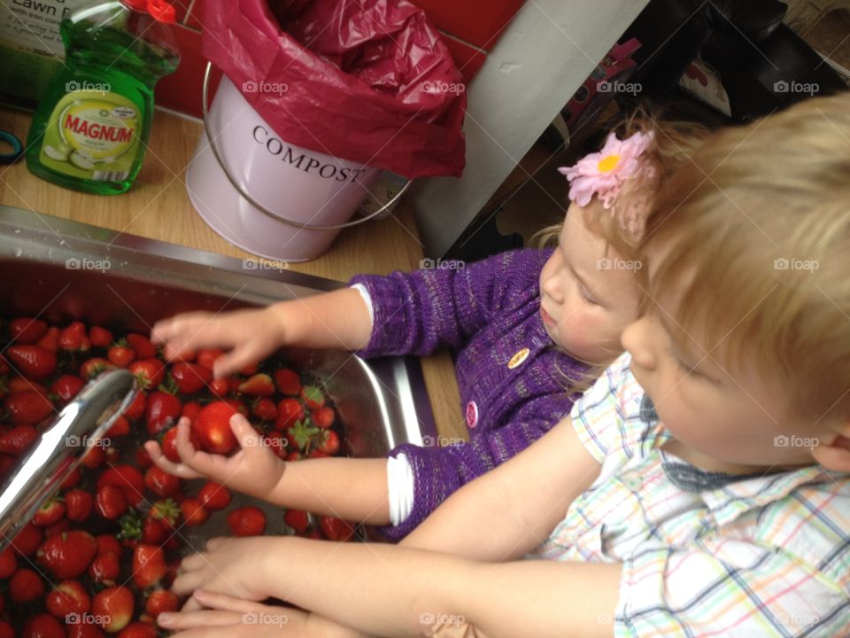 Little helpers (big on eating strawberries) 