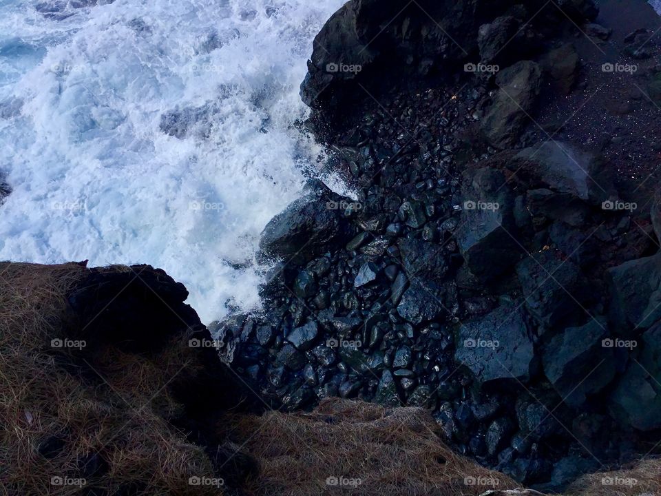 Sea meets lava rock
