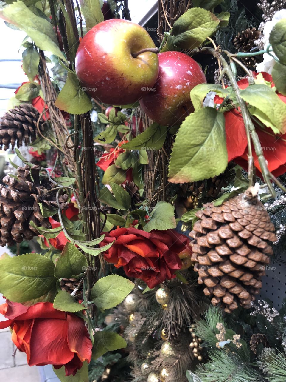 Another Christmas decoration which l think is enhanced with the addition of the roses red apples.