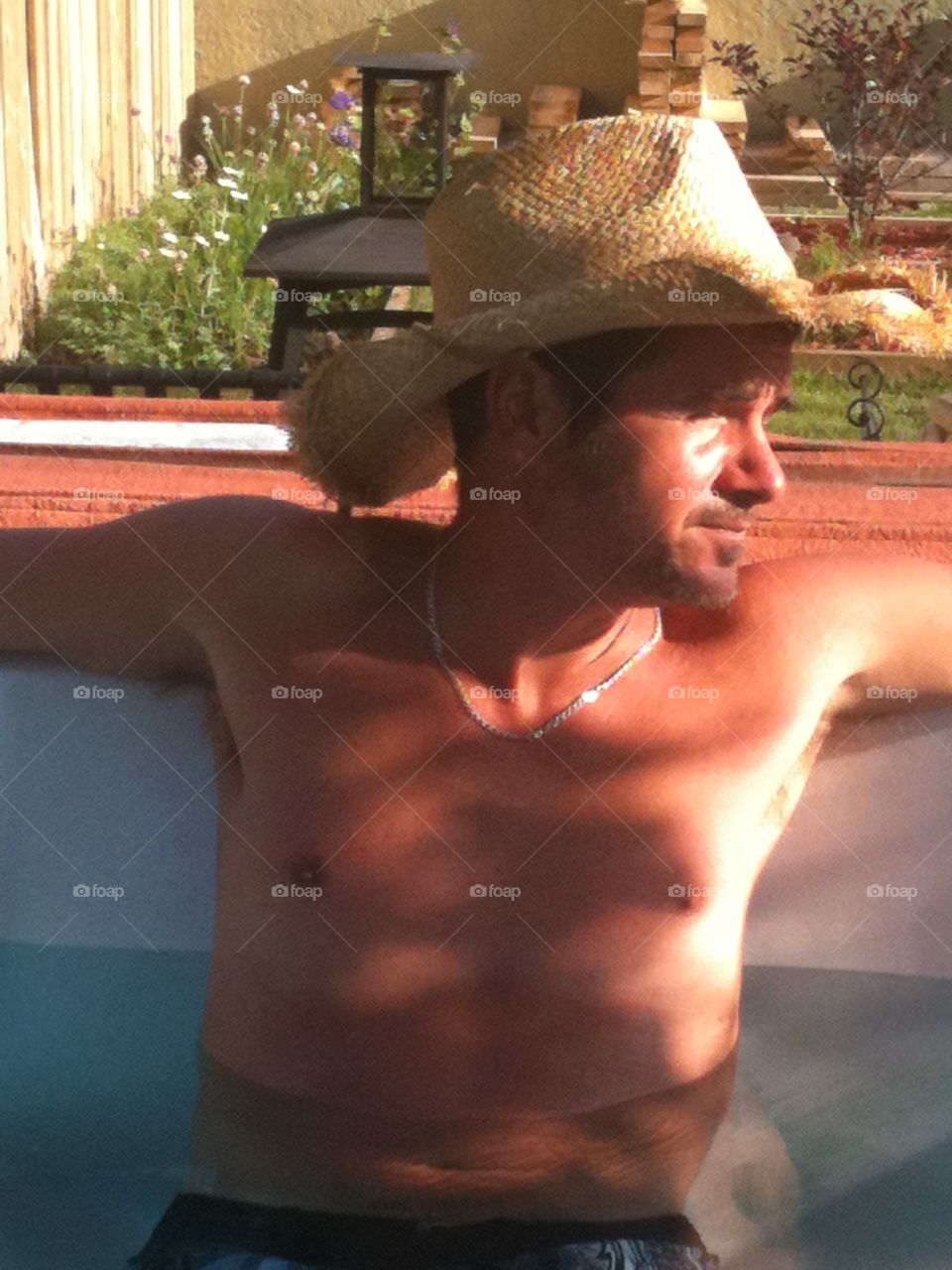 Cowboy in hot tub 