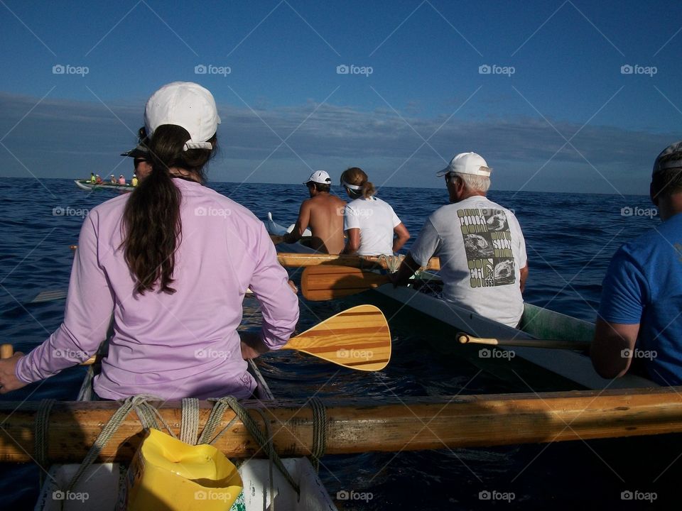 outrigger paddle. paddling off the big island