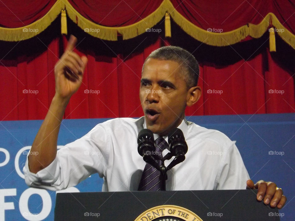 President Obama Speaking at Uptown Theater. I attended President Obama's speech at the Uptown Theater in Kansas City in 2014. I was right up front and shook his hand. I snapped several photos, including this one.
