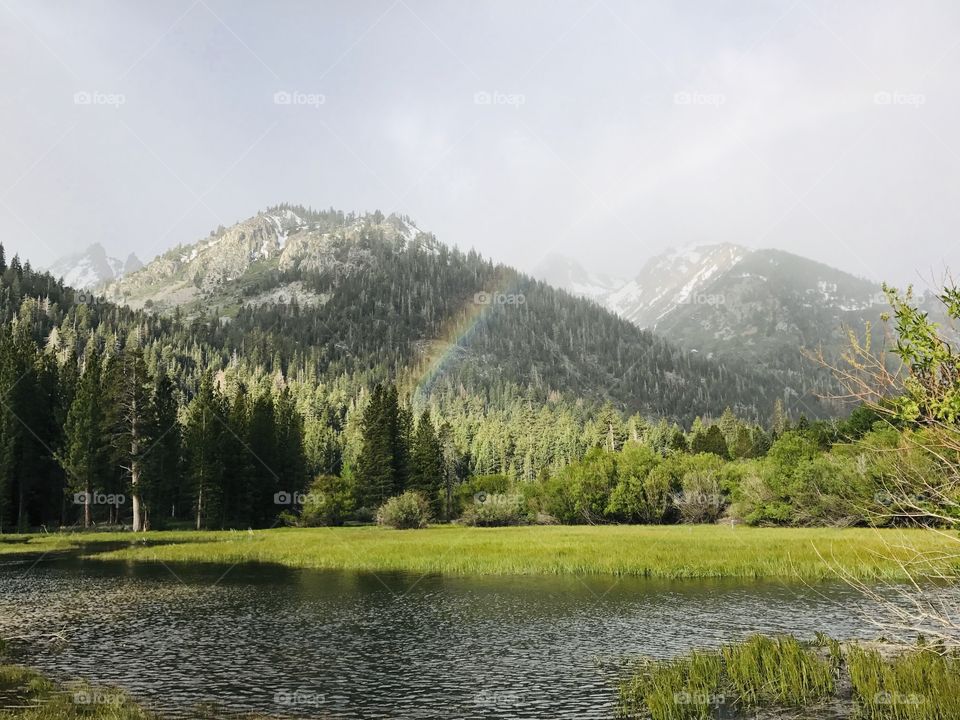 Rainbow at Upper Twin lake in Bridgeport California. Beautiful scenery. Peaceful, quiet and breathtaking.