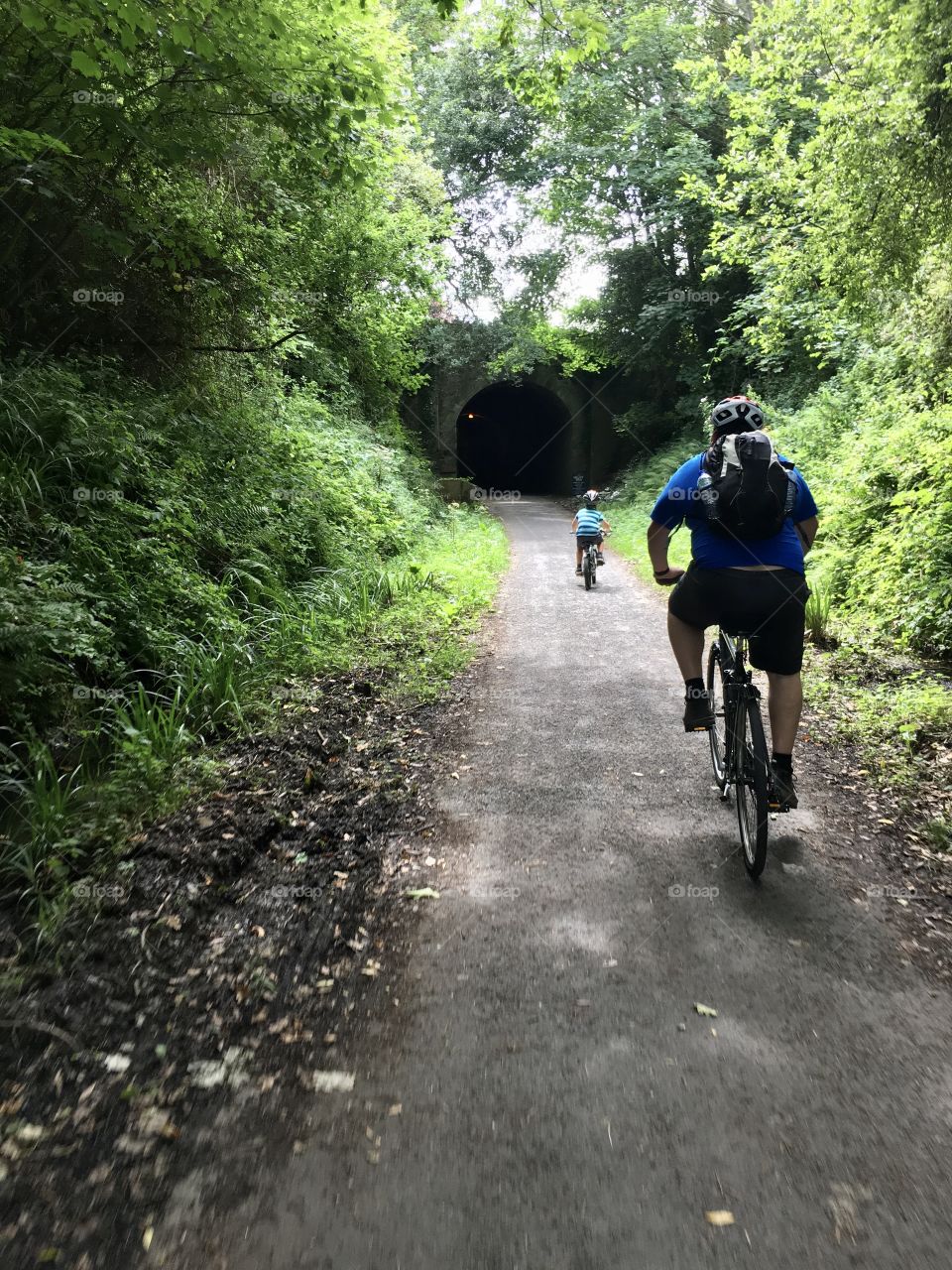 Man and boy on bikes