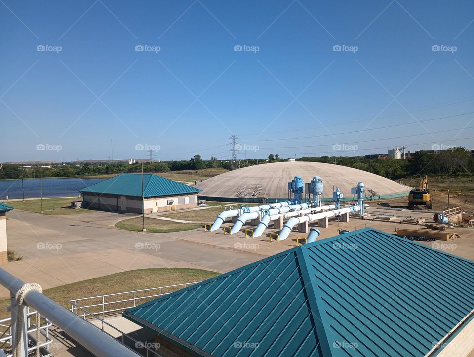 amazing photo of large water treatment plant in Texas, can see large clear well and some of large pumps