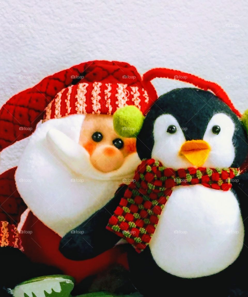 Colorful Santa Claus decoration with a winter penguin