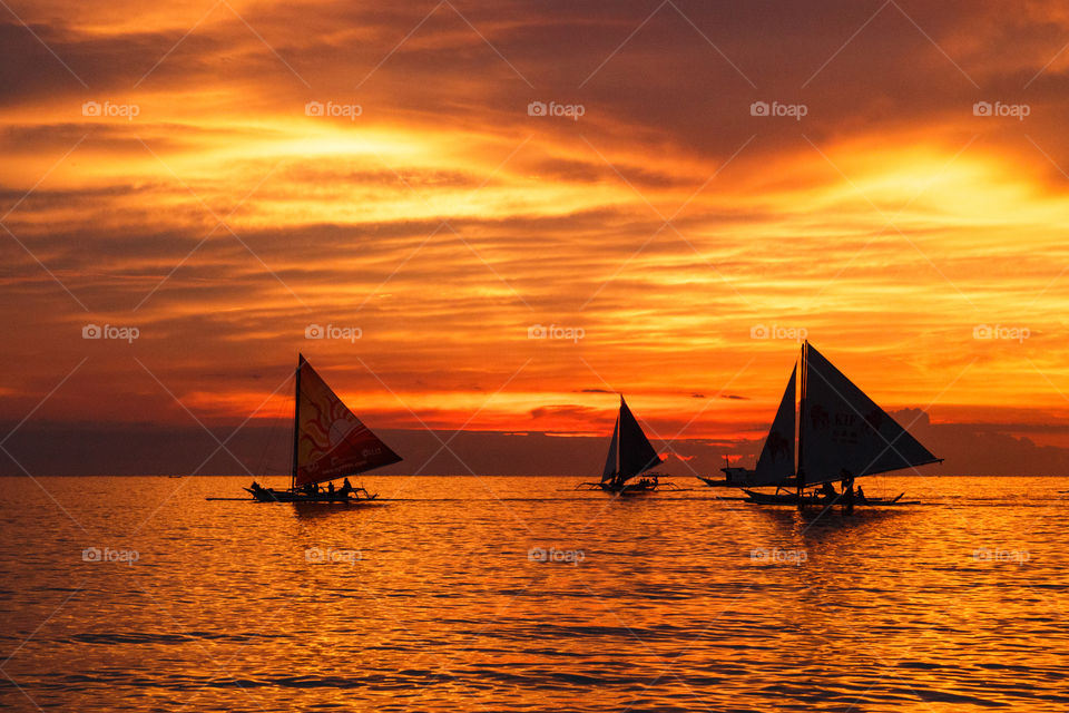 Sailing boats on the on sunset 