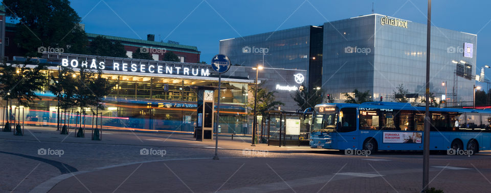 long exposure shot of the travel center in downtown Borås Sweden with a bus ghosting through the photo