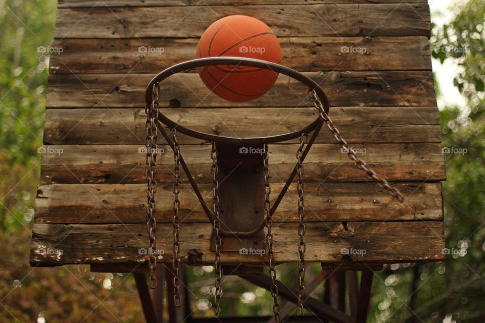 The ball flies into the basketball hoop