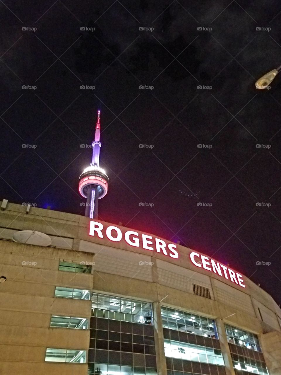Not sure what those lights are in the sky next to the CN tower took the picture outside no windows or reflections?