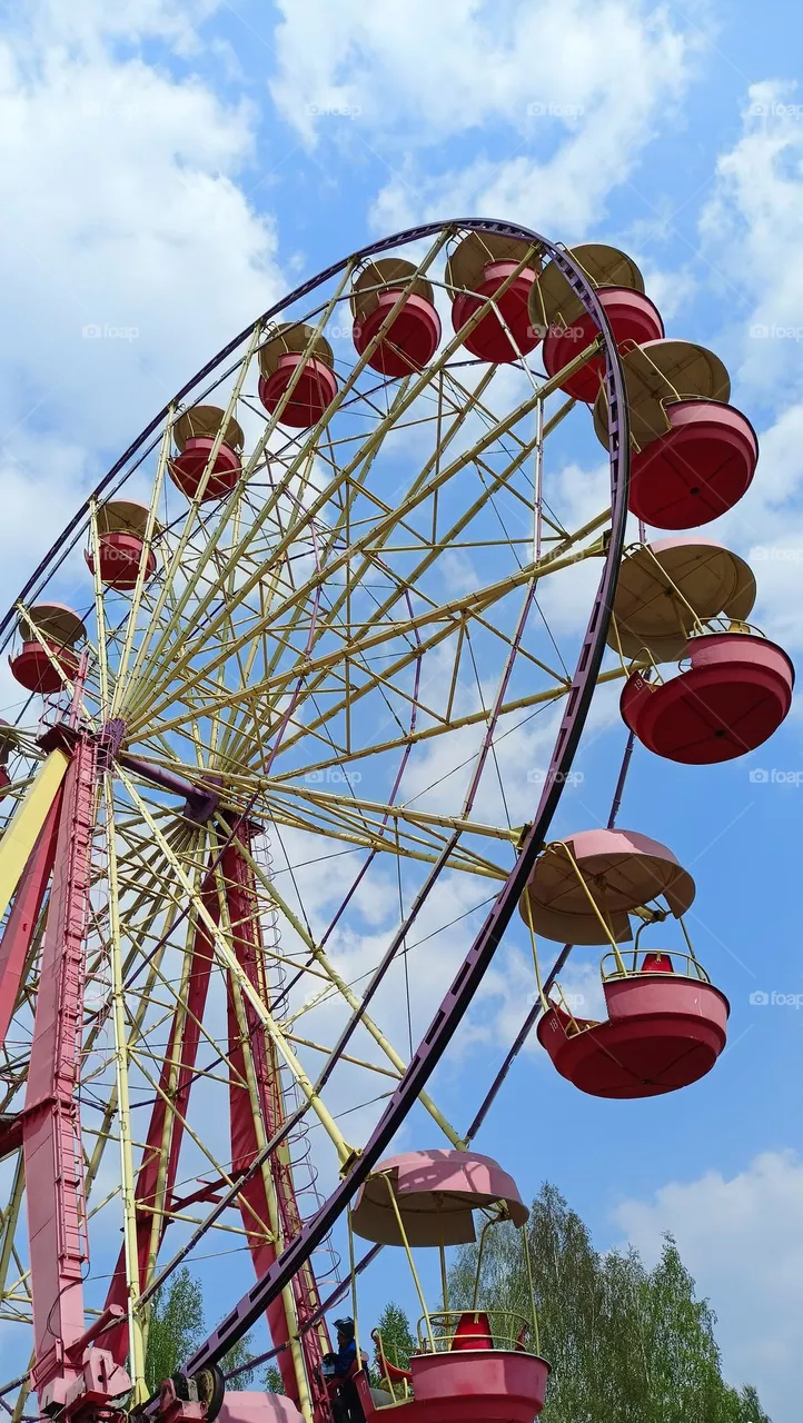 Amusement park, wheel, circle, sky, spin, red, blue, clouds
