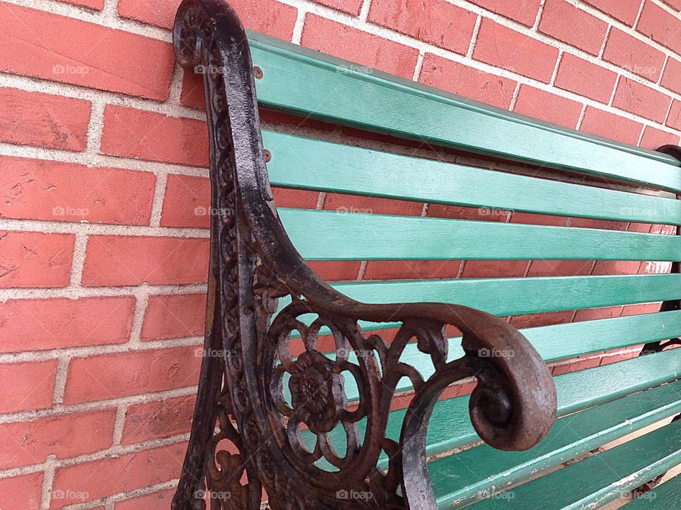 Antique bench of wood and wrought iron.