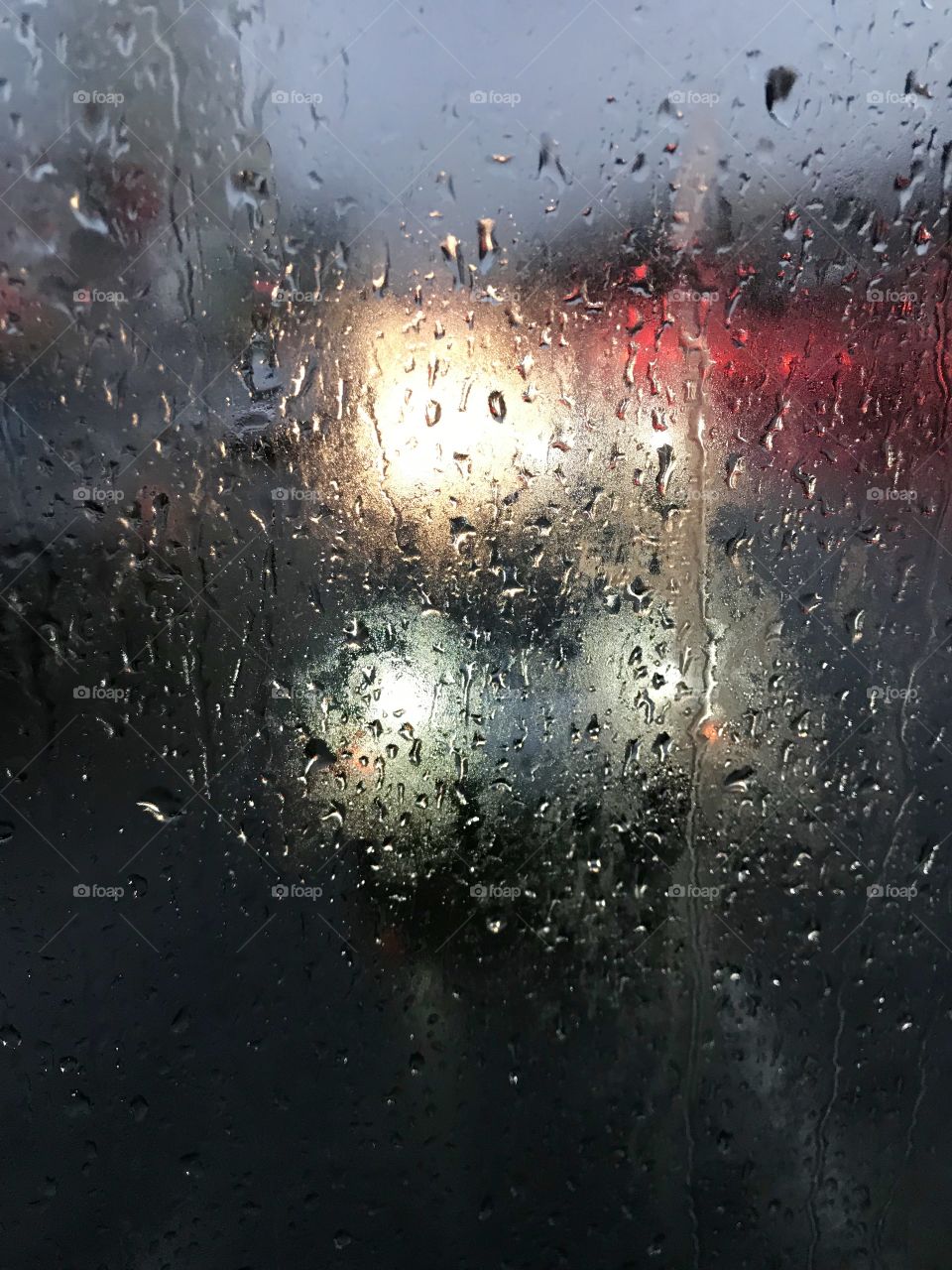 Raindrops on foggy glass 