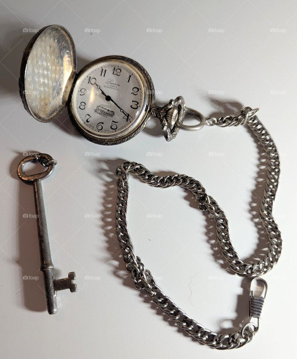vintage pocket watch and skeleton key