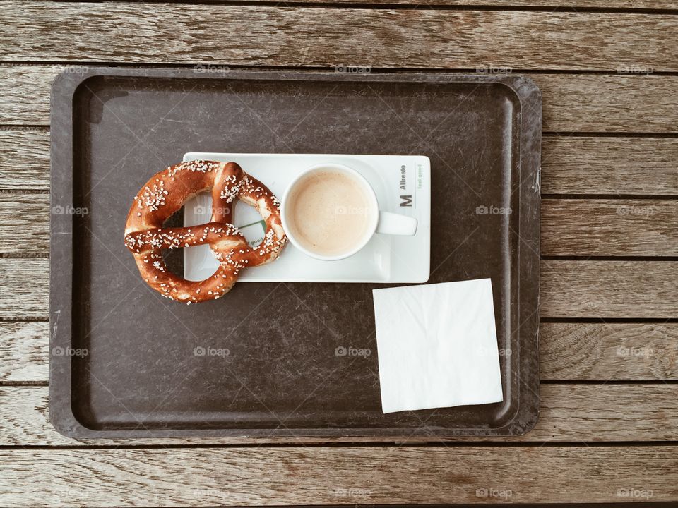 Bavarian pretzel and coffee. Bavarian breakfast with pretzel and coffee
