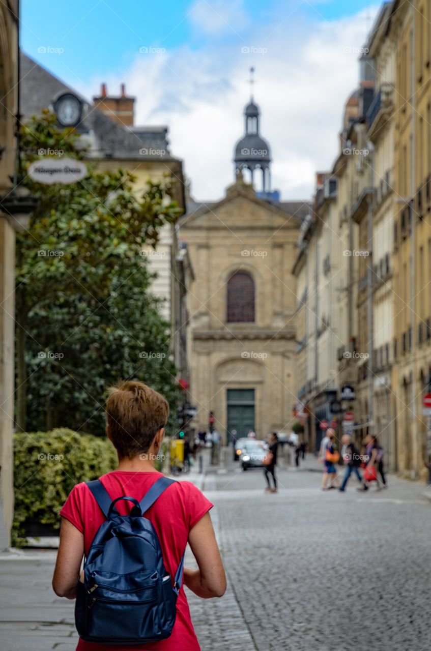 Rear view of woman walking on street