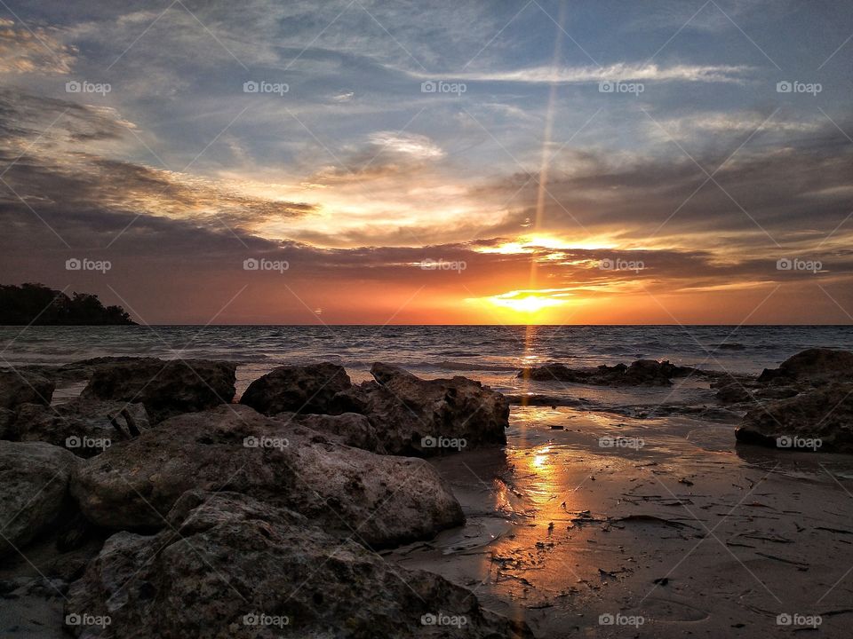 sunset light behind the rock