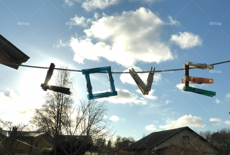 The word love written with  clothespins