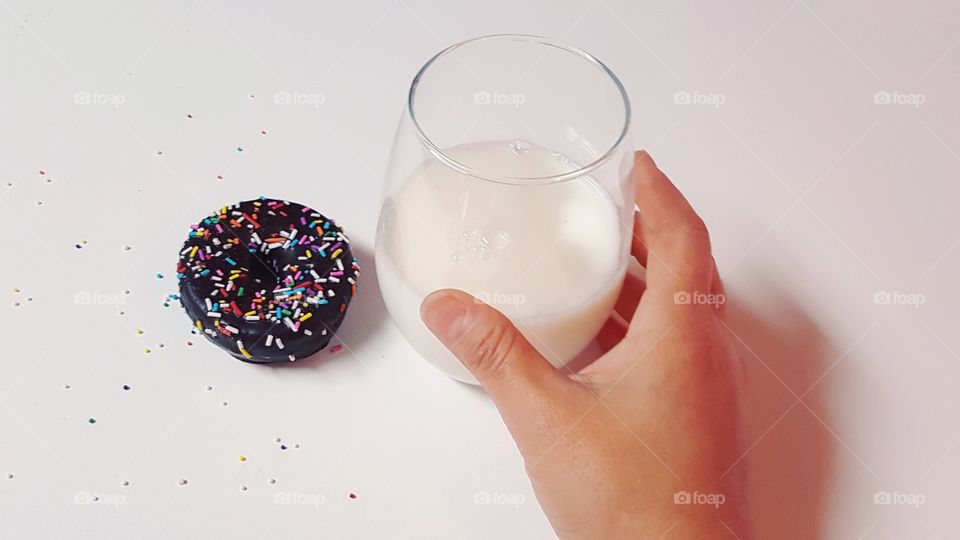 Mini-donut and glass of milk