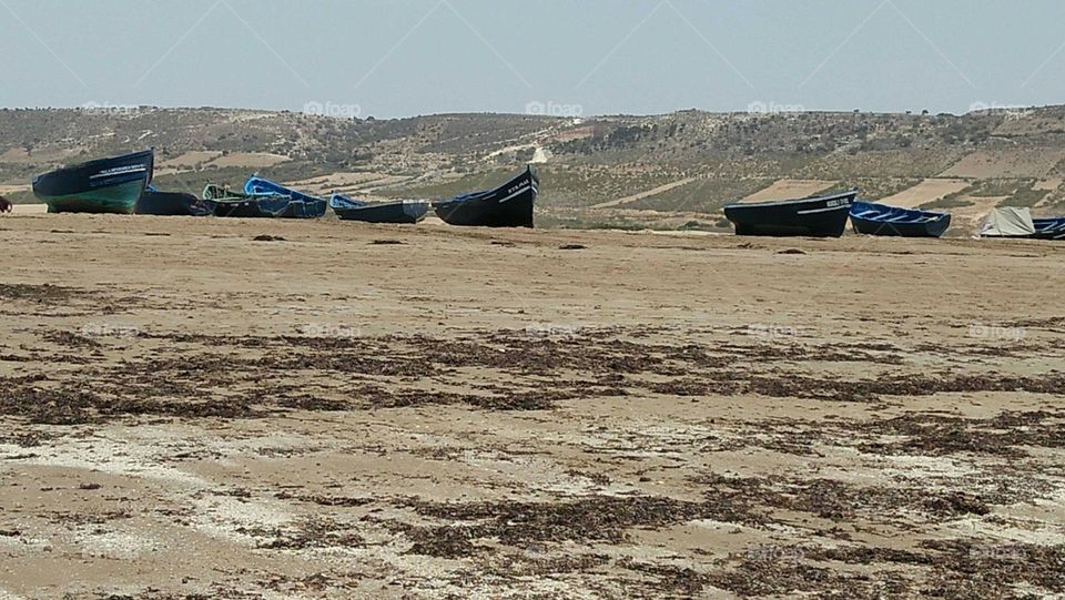 Beautiful boats near the beach on sand