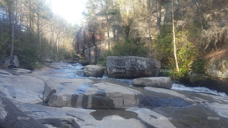 water flowing over rock