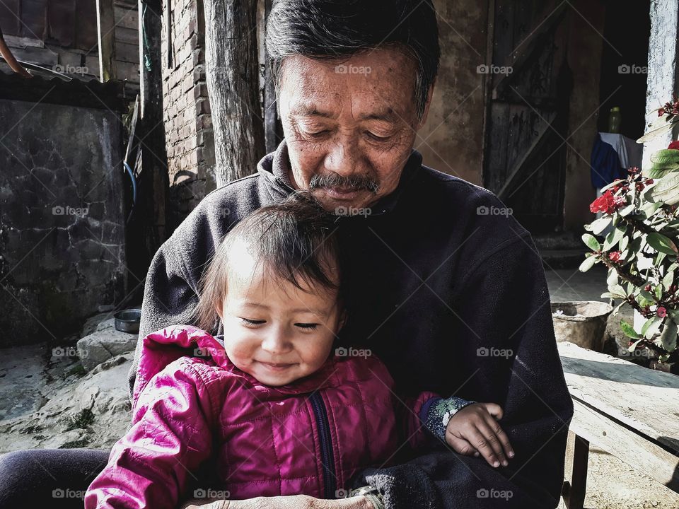 Uncle and niece having a wonderful time together. Old and new generation.