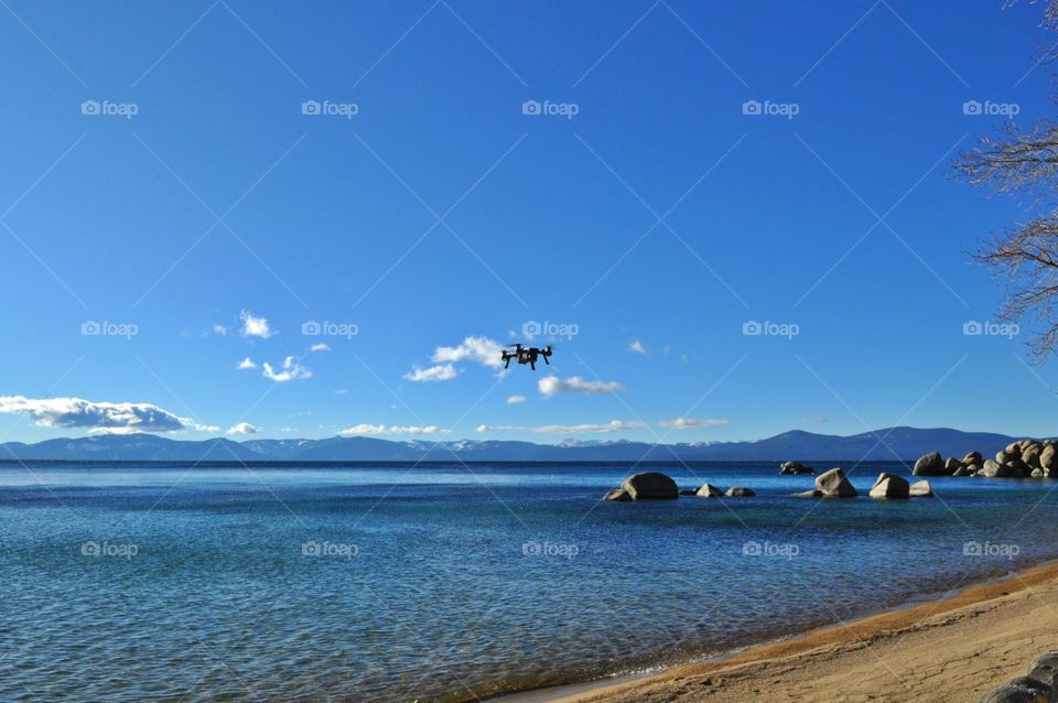 Flying drone over the lake