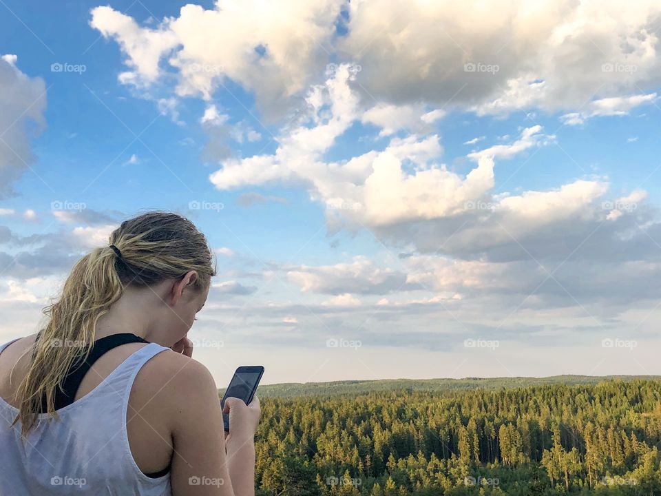 Girl taking photos over the views