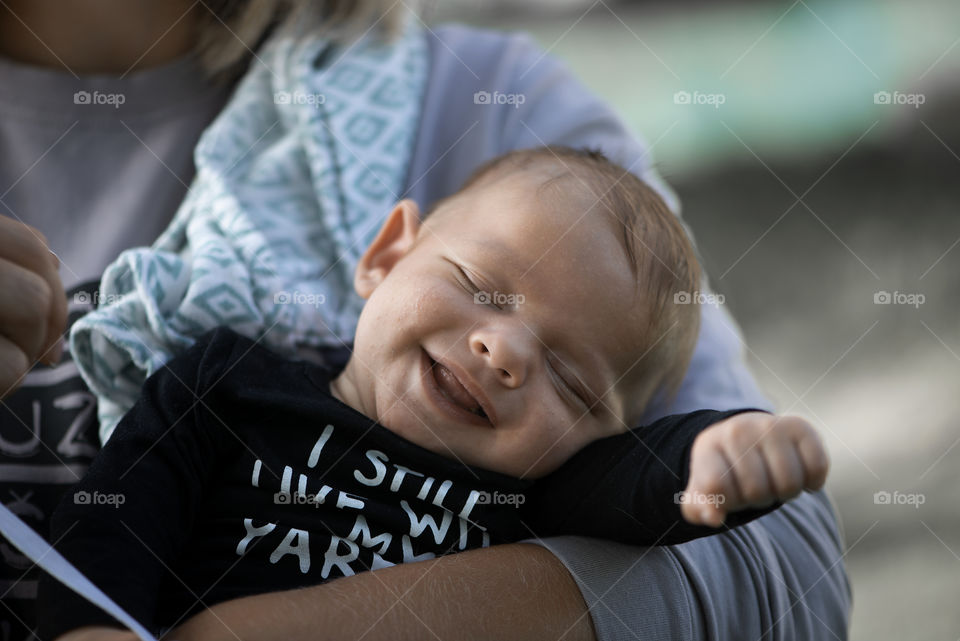 Mother holding smiling baby boy