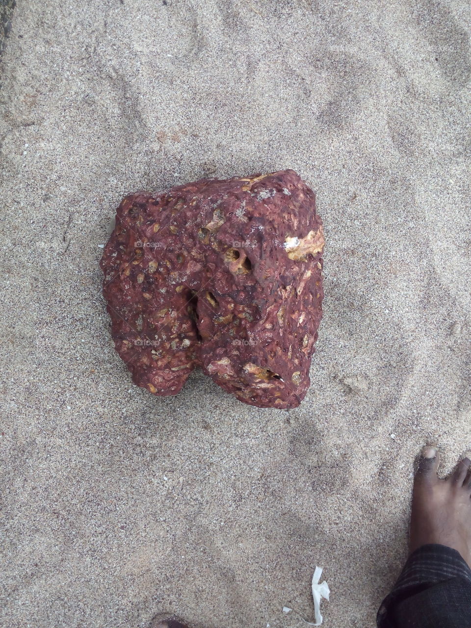 Photo of a beautiful rock on the beach.