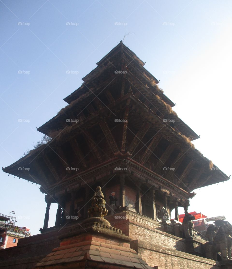 This is a natapol temple of nepal with five stares in a pagoda style which is located in bhaktapur city , which is one of the famous tourism area of country Nepal