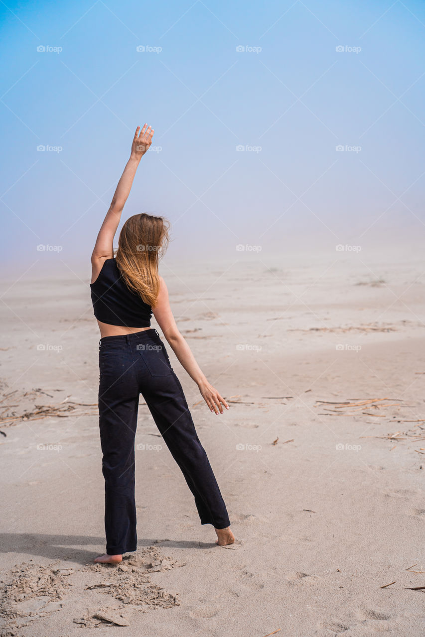 All you need for harmony is just yoga on the beach.