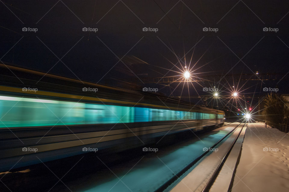 Train in the railway station at night