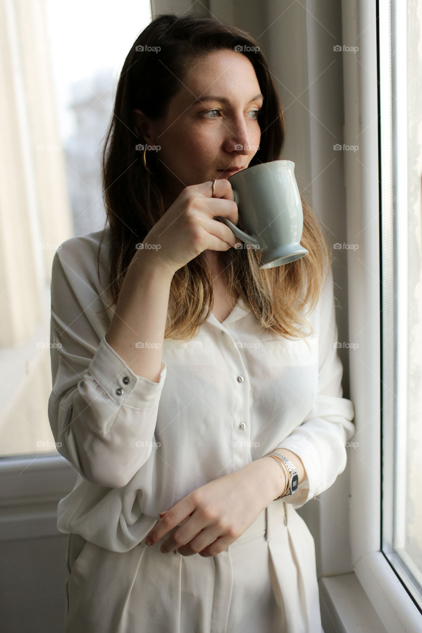 Woman drinks coffee
