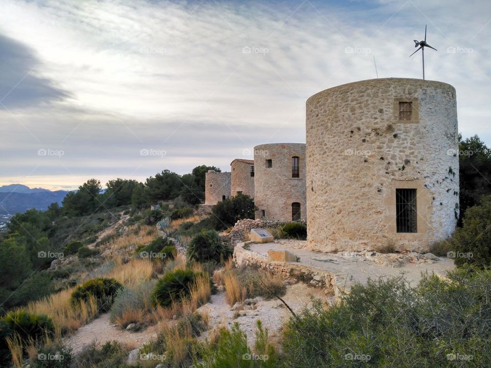 Molins de la Plana, from the 14th century, in Javea, Spain. On a cloudy sky in a winter day.