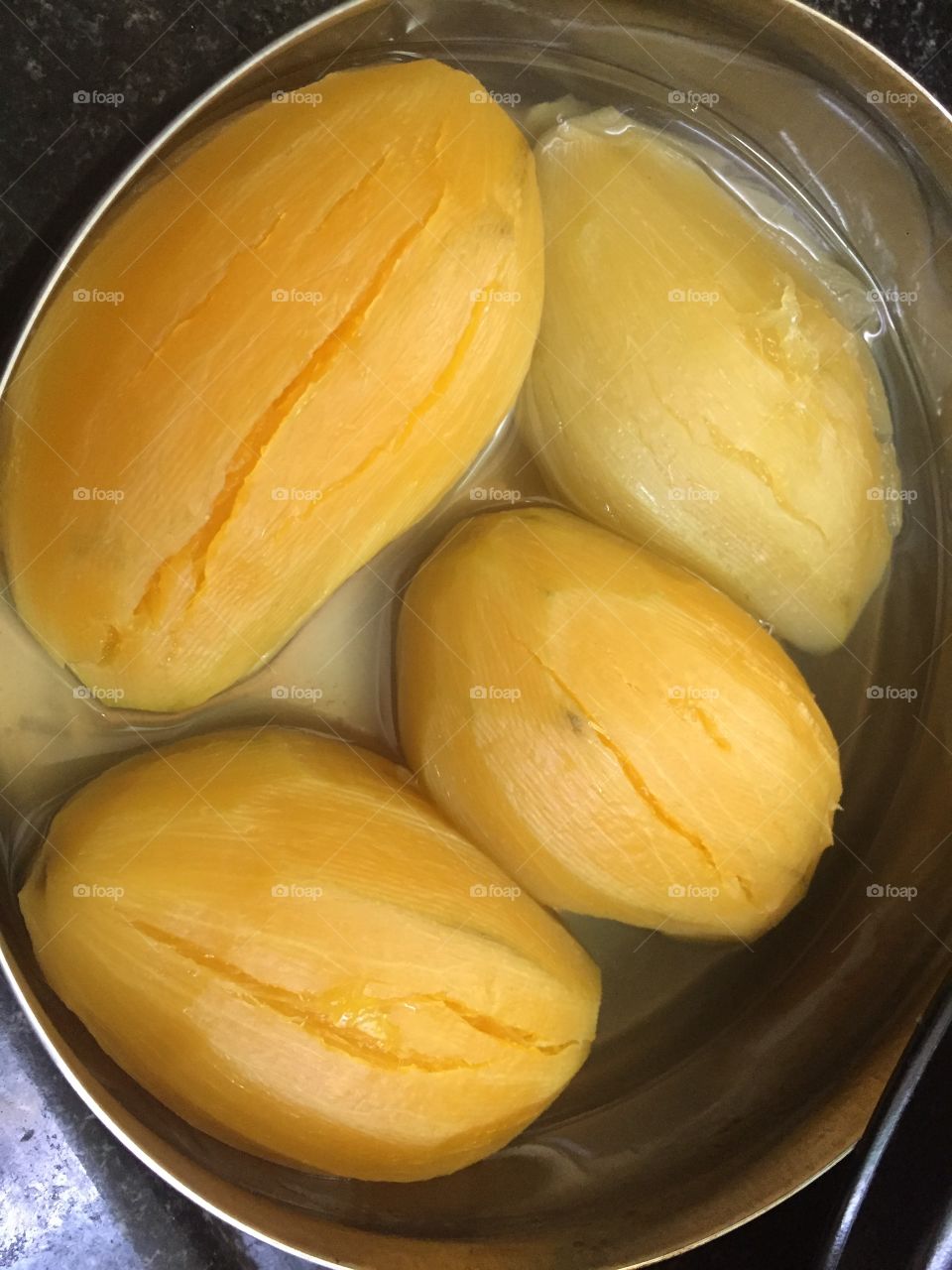 A traditional indian recipe we have do this every summer- *) take raw mangoes in a bowl fill it with water and cook them in a pressure cooker, rice cooker or solar cooker for15-20 take out a little water add sugar, blend add more water in concetrate 
