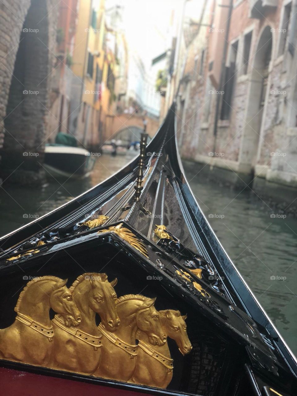 A gondola through a venetian canal 