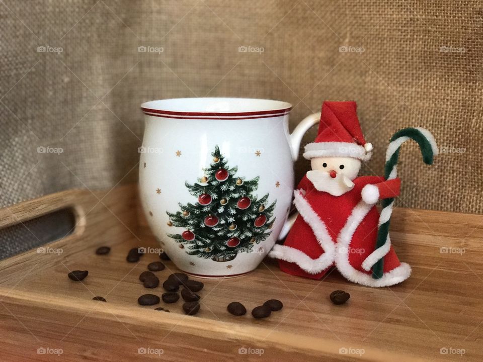 Santa Claus and cup of coffee.