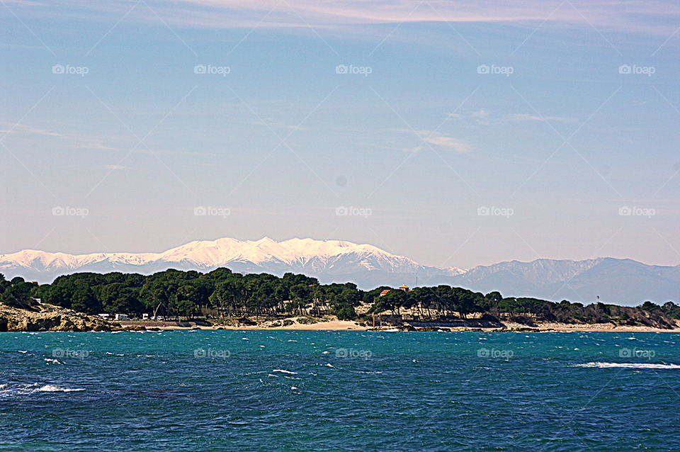 Mediterranean sea with the snowy Pyrenees in the background