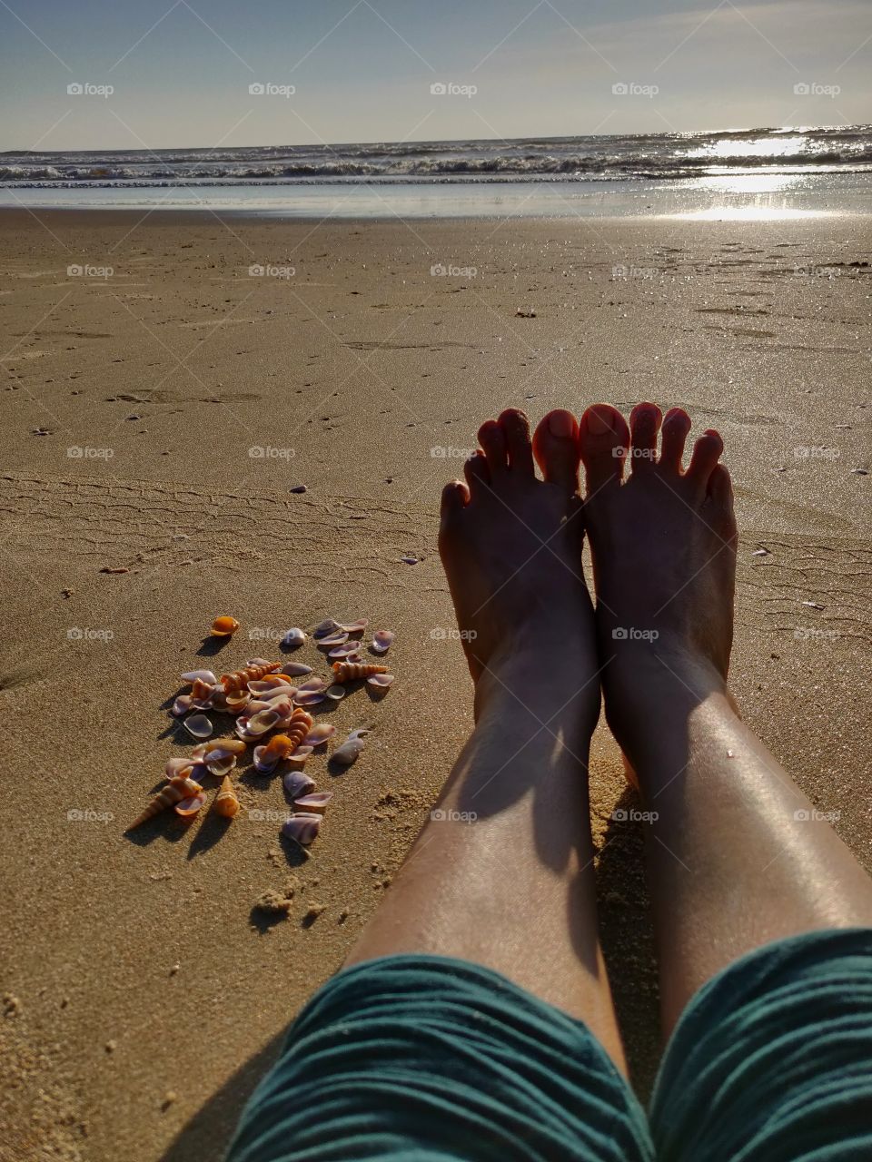waiting to see the sunset with the shells I collected to take home