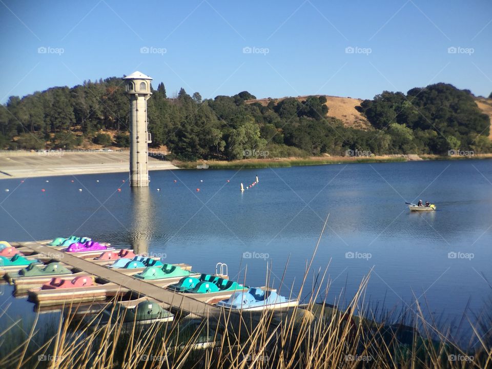 Lake with boats and tower