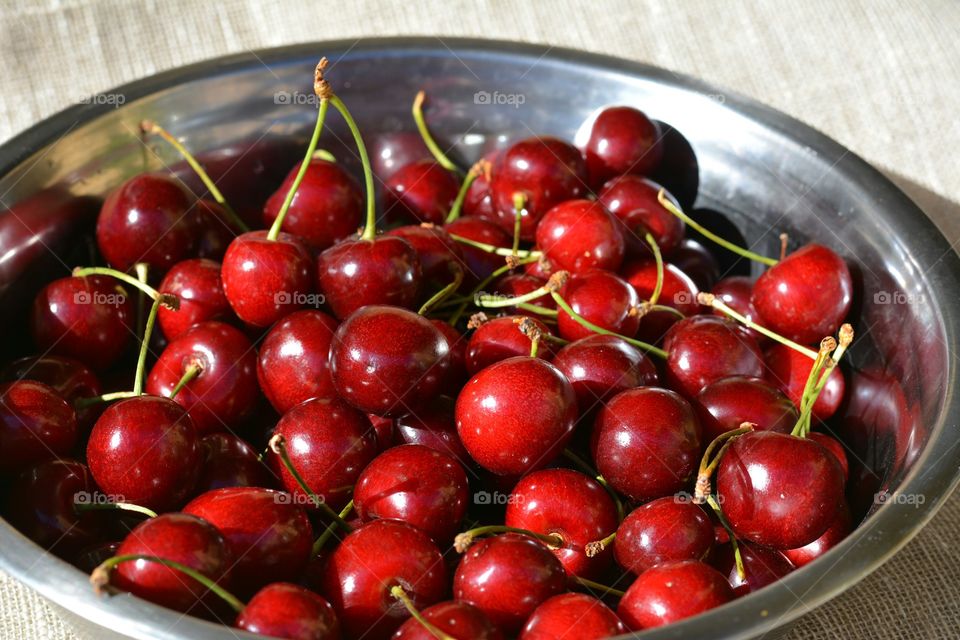 red cherry summer food on a plate natural background