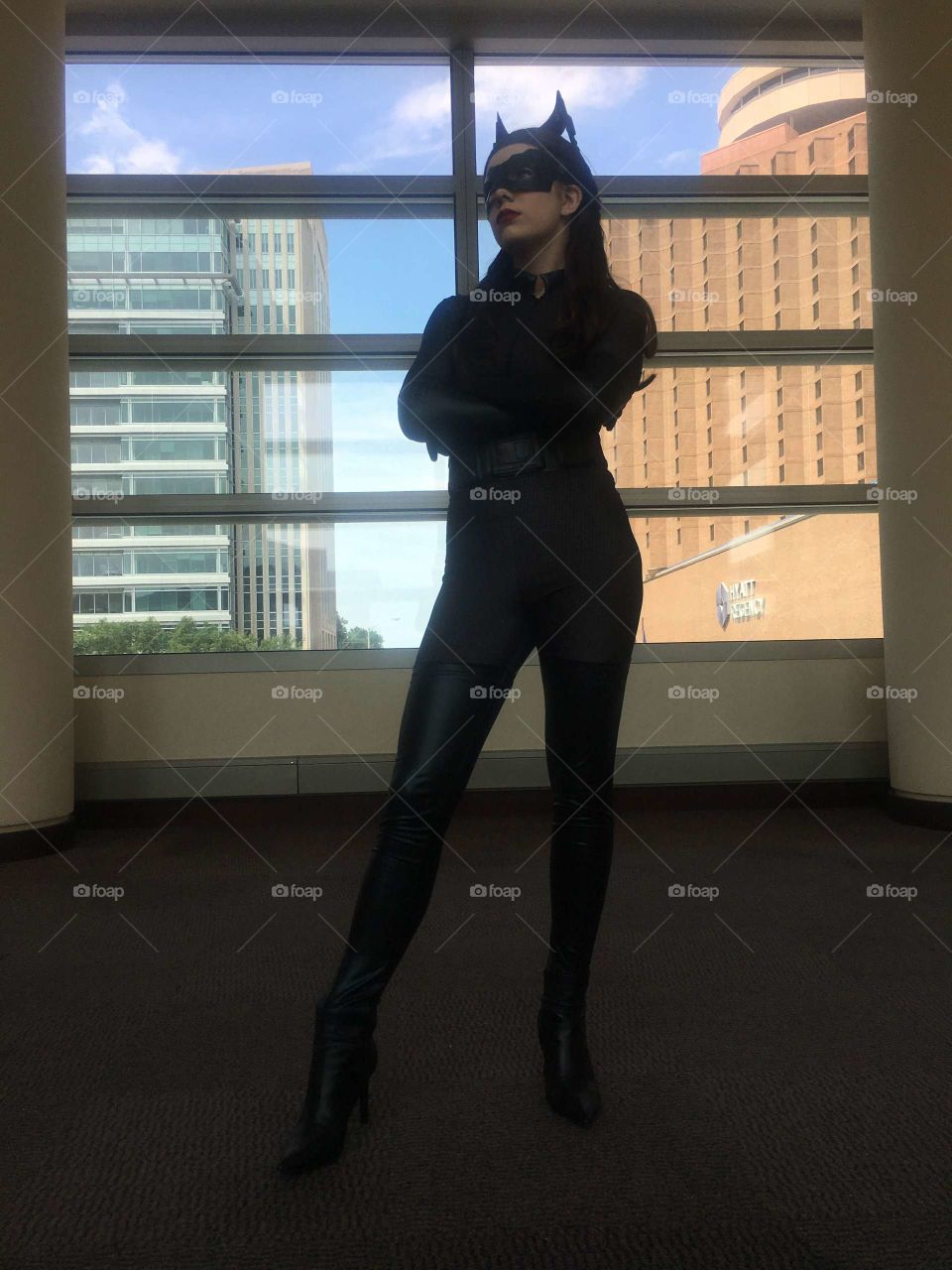 A bold young woman cosplaying as Catwoman