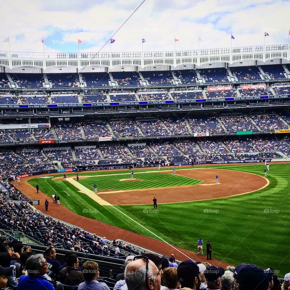 Summer Photo of Yankee Stadium during a baseball game from high seats. 