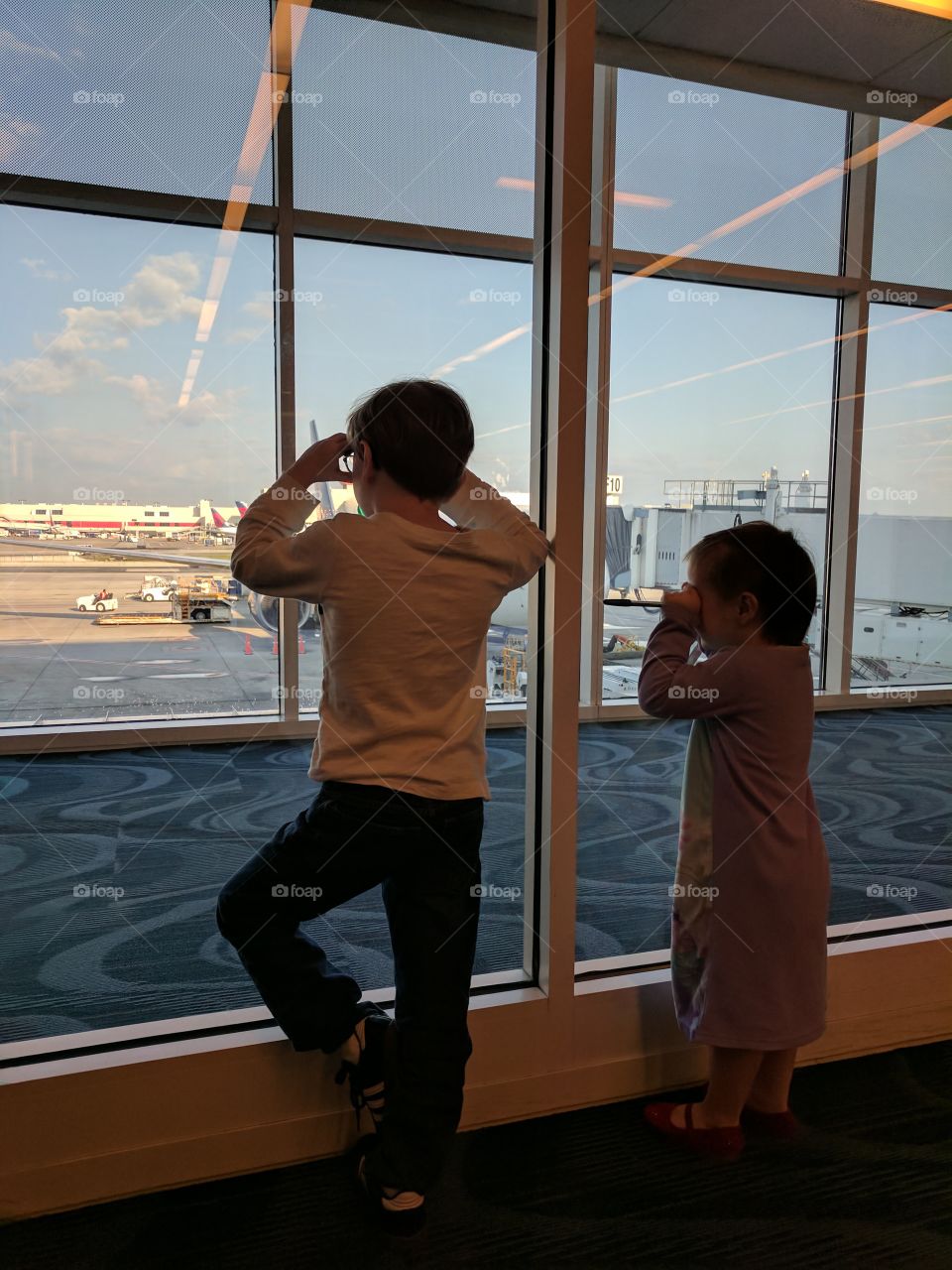 Dad works at Delta, so we flew to Seattle. The kids were mesmerized by the planes for about 40 seconds. I wish we knew how to ponder the mystery I while longer.